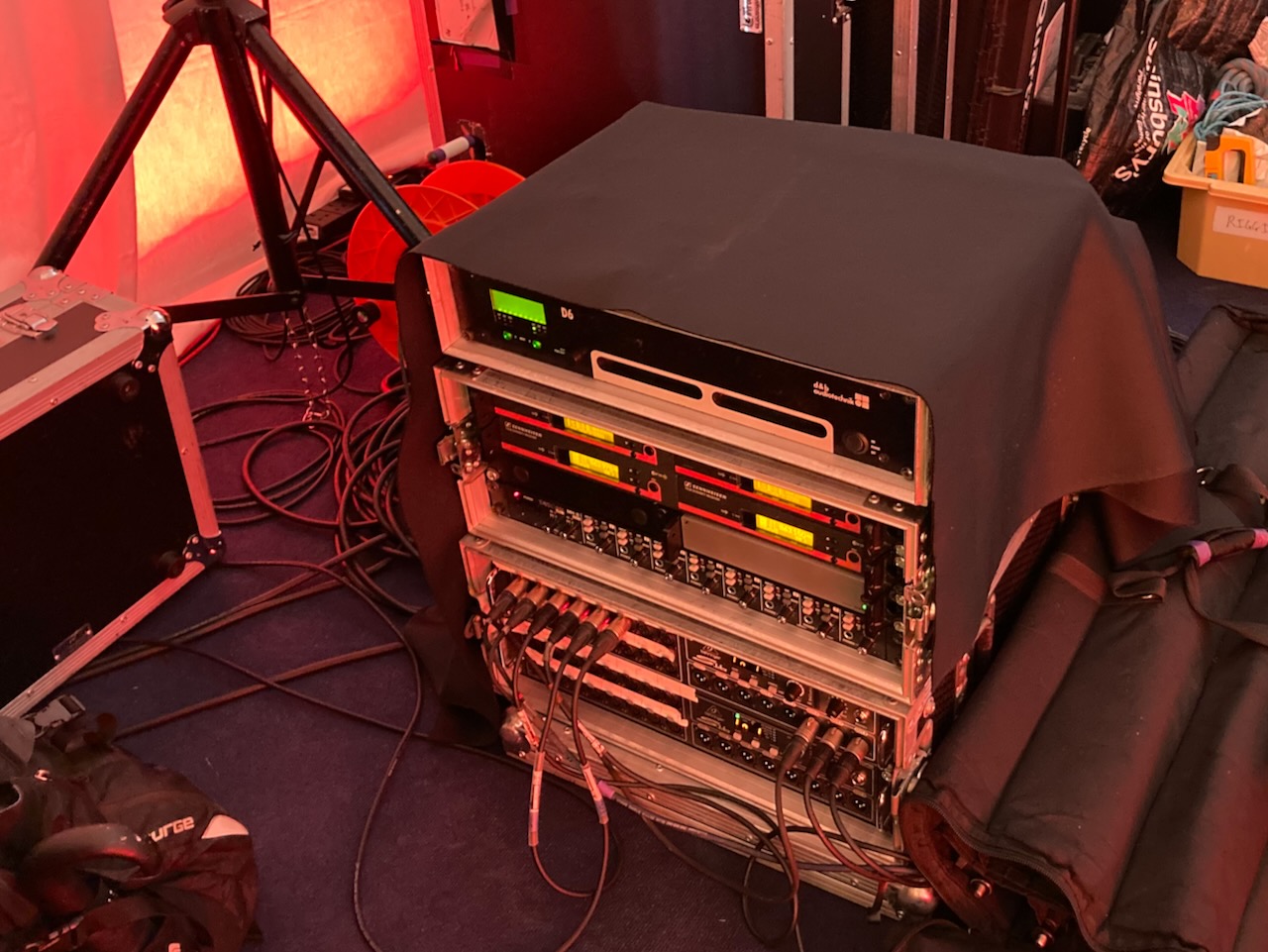 A stack of sound equipment and cables